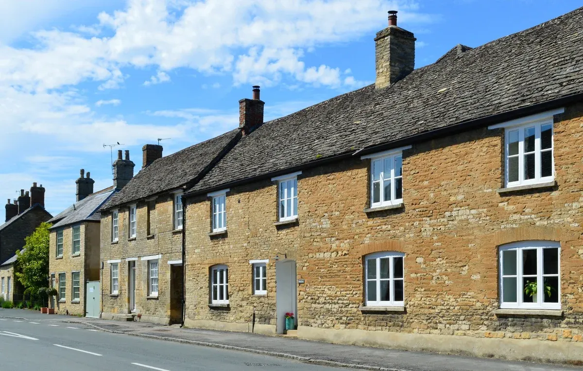 Stone cottages on High Street in Bampton, the Downton Abbey village, on a Downton Abbey day trip from London