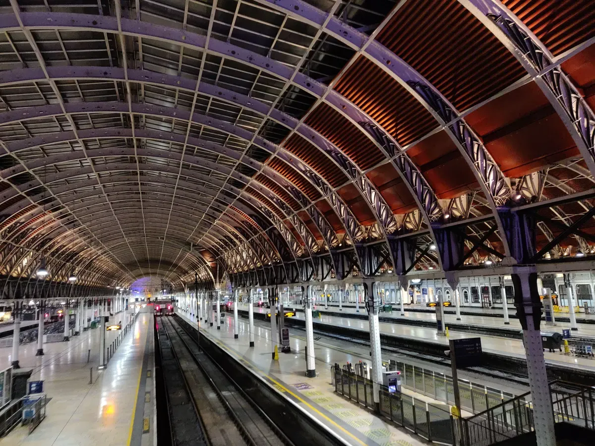 Curved train shed roof over the platforms at London Paddington for planning a day trip from London